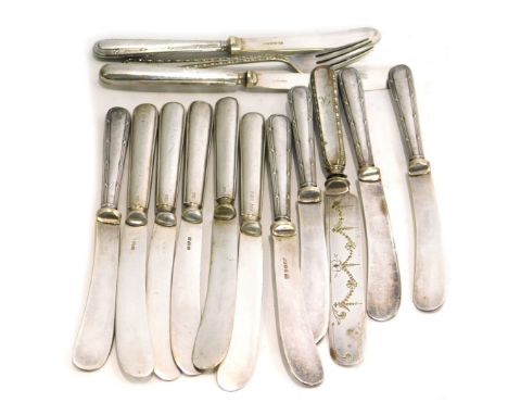 A group of Edward VII and later silver handled and stainless steel bladed knives, and one knife and fork set.