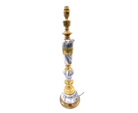 A Continental marble and brass table lamp, cast with a precession of figures with coach horses, 66cm high.