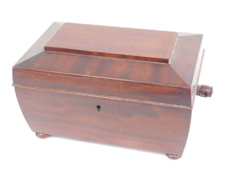 A Victorian mahogany sarcophagus shaped caddy, the hinged lid enclosing an interior with two smaller caddies flanking a mixin