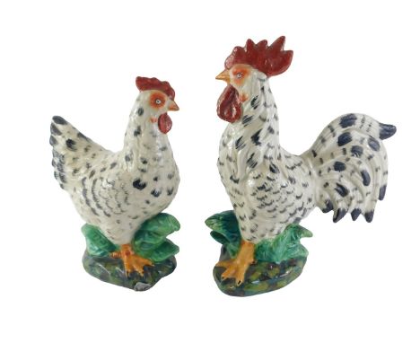 A pair of ceramic cockerels, 32cm high. 