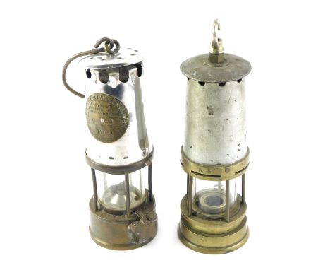 Two miner's lamps, comprising one Protector Lamp and Lighting Company, type 6 number 2, with swing handle, 23cm high, and ano