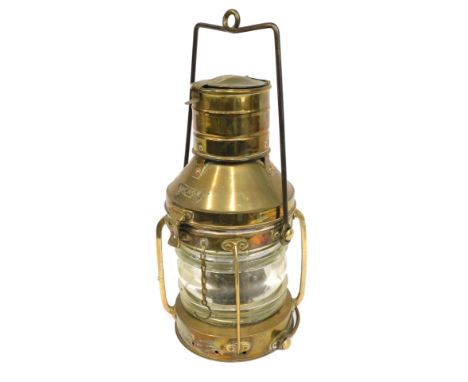 A late brass ship's lamp, with label Anchor. 