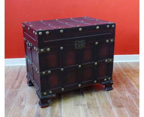 Contemporary storage trunk with patinated metal studwork and clasp, on shaped ogee supports, 60 x 56 x 42cm