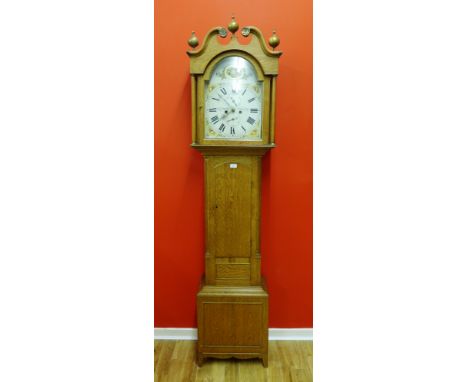 A 19th Century oak cased long case clock with broken pediment and finial hood, the white circular dial with Roman numerals ab