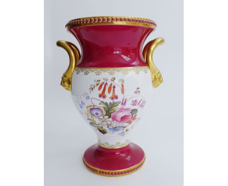 Spode porcelain campana vase painted with flowers between claret and gilt borders, with twin iron mask handles to sides, sign