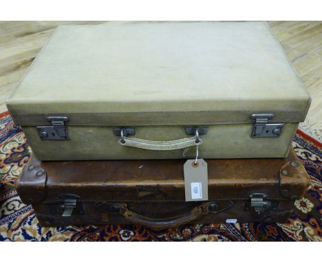 A vintage brown leather suitcase retailed by R. W. Forsyth Limited, stamped with initials H.W.K. (Henry Wright Kerr) together