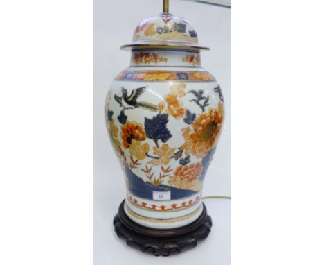 Chinese baluster vase and cover, converted to a table lamp base, complete with shaped hardwood stand, 52cm high