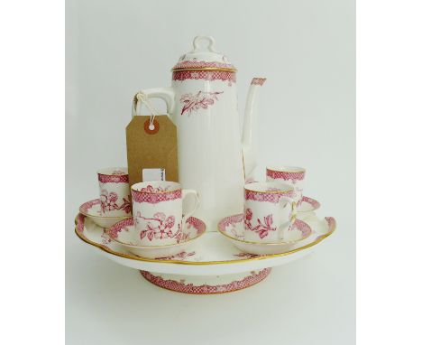 A Royal Worcester cabaret set comprising six coffee cans, six saucers, coffee pot, and a circular tray on pedestal stand, all