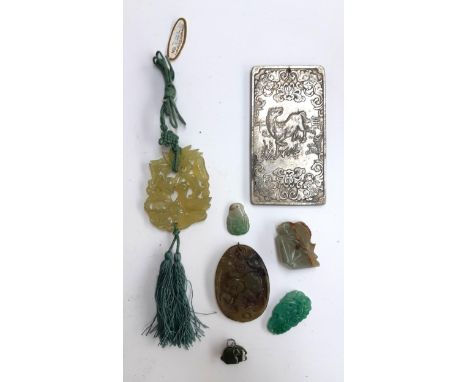 A mixed lot of Chinese jade items to include a bird in foliage, leaping fish, pig medallion, white metal zodiac talisman etc 