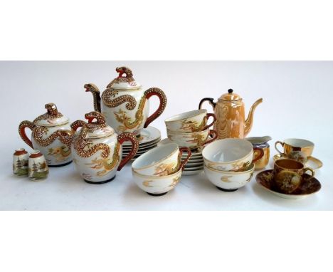 A Japanese Kutani china tea service, orange lustre Noritake coffee pot, a burgundy and gilt teacup and saucer with Vienna por