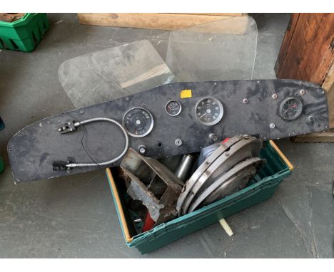 Two boxes of vintage car parts to include dashboard, hub caps, engine items etc 