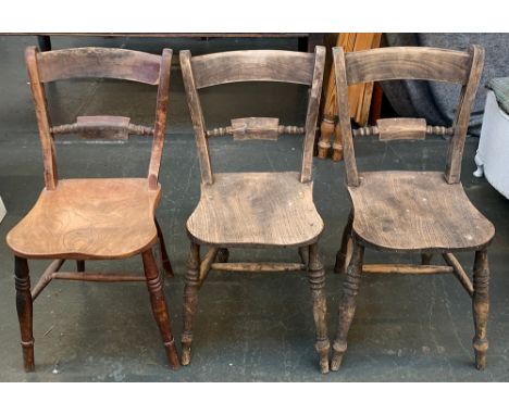 A pair of 19th century kitchen chairs on ring turned legs and H stretchers; together with one other similar (3) 