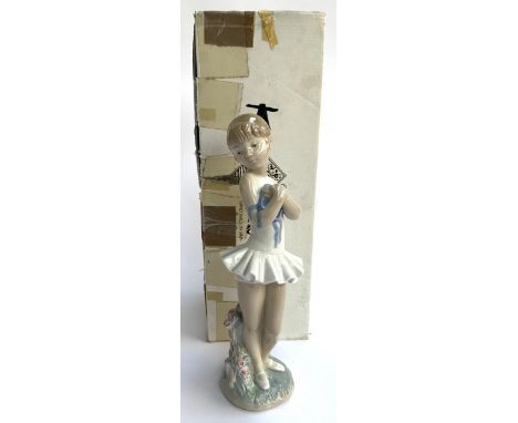 An Nao by Lladro figurine, girl in tennis dress, 30cmH, with original box 