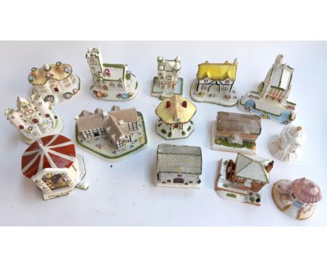 A lot of fourteen various Coalport ceramic cottages to include The Coaching Inn, Clock Tower, Shakespeare's birthplace, Villa