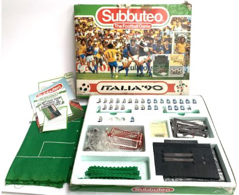 A Subbuteo Italia 90 World Cup edition game to include players, balls, playing pitch etc, box af 