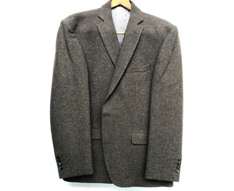 An Austin Reed brown herringbone wool jacket, 46R, with jacket cover 