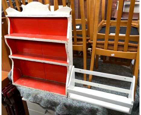 A white and red painted wall hanging shelf, 64cmW; together with a single hanging shelf, 51cmW 