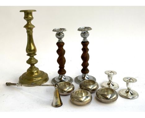 Four heavy white metal tea light holders, each 7cmD, together with two pairs of candle holders, a brass candlestick holder an