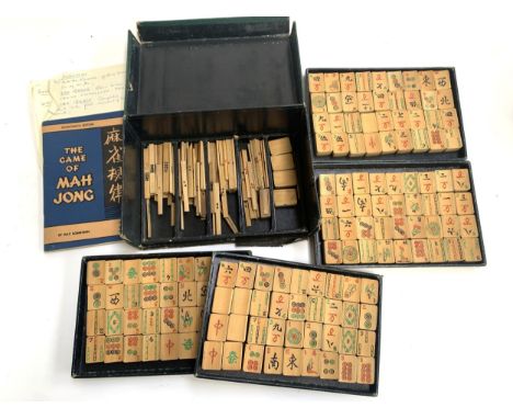 A mahjong set, Shanghai consisting of tiles, dice, scoring sticks together with a Max Robertson rule book, (box af) 