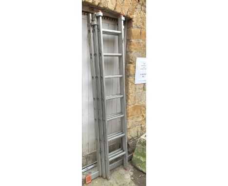 A Favorit three section extending aluminium ladder, each section with seven rungs, 5m total 