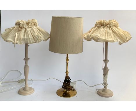 A pair of turned beech table lamps, together with one other gilt metal table lamp, 58cmH to top of shade 