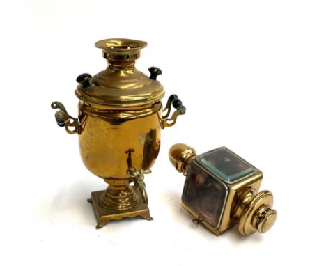 A brass samavar with turned handles, together with a brass carriage lamp with bevelled glass and vintage electrical fitting 