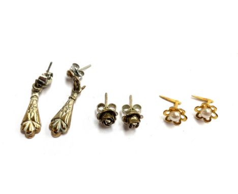 Three pairs of earrings to include white metal roses, 9ct gold and pearl, and one other pair 