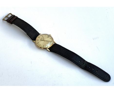 A gents rotary gold plated wristwatch, stainless steel snap back, baton hour markers with date aperture, 32mmD 