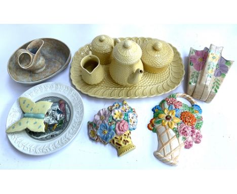 A Beswick ceramic plaque in the form of a flower basket, number 551, together with an Arthur wood ceramic wall vase, Crown De