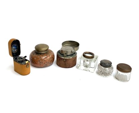 A collection of various ink wells, to include a leather covered travelling inkwell with glass bottle; a larger travelling ink
