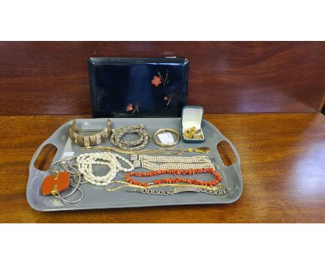 Assorted costume jewllery to include Monet &amp; M&amp;S, coral necklace, seed pearls, etc and a lacquer box and tray.