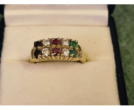 Heavy 9ct gold ring set with 2 emeralds, 4 diamonds, 2 rubies and 2 sapphires, size M.