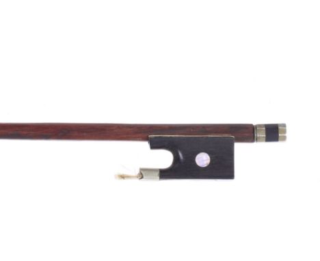 Nickel mounted violin bow circa 1850, the stick round, the ebony frog inlaid with pearl eyes and the ebony adjuster with two 
