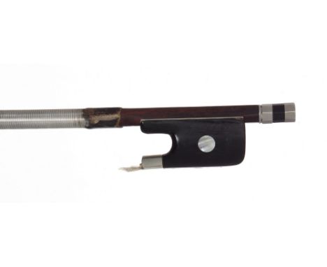 Nickel mounted violoncello bow, the stick round, the ebony frog inlaid with large pearl eyes and the ebony adjuster with two 