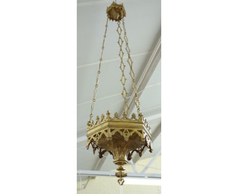 Two similar gilt brass hanging lanterns of Victorian Gothic form, late 19th century, each castellated rim over a tapering spi