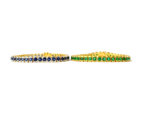 A gold and emerald set line bracelet, mounted with a row of circular cut emeralds, on a snap clasp, detailed 750 18 K, length