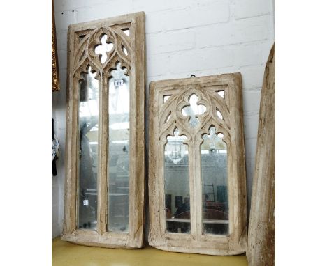 A plaster framed wall mirror, late 20th century, depicting a rectangular glazed Gothic window and a pair of matching smaller 
