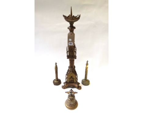 A Victorian brass altar stick of Gothic form (70cm high), two Victorian brass table screens/fans and a brass inkwell of bell 