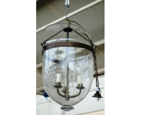 A glass hundi style lantern, early 20th century, with etched decoration and internal three light fitting suspended on linked 