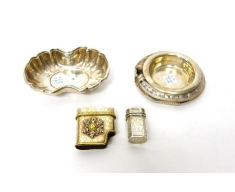 A hinge lidded cachou box, with engraved decoration, possibly Dutch, a Middle Eastern bangle converted for use as a dish, a p