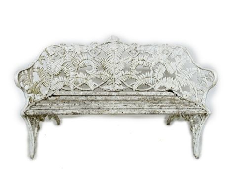 A suite of Coalbrookdale design white painted fern and berry pattern garden seats comprising; a bench, 152cm wide, and a pair
