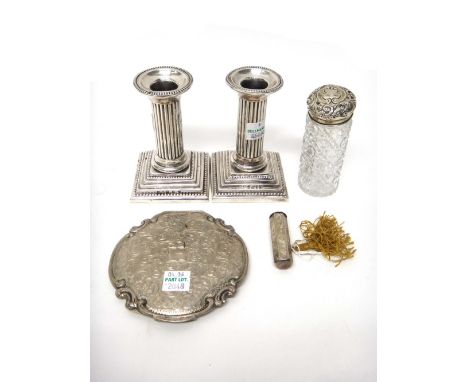 A pair of Victorian silver candlesticks, each designed as a fluted column, on a stepped square base, decorated with beaded bo