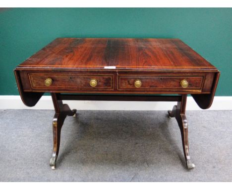 A George III inlaid rosewood sofa table, with a pair of frieze drawers and dummy opposing, on trestle end standards and four 