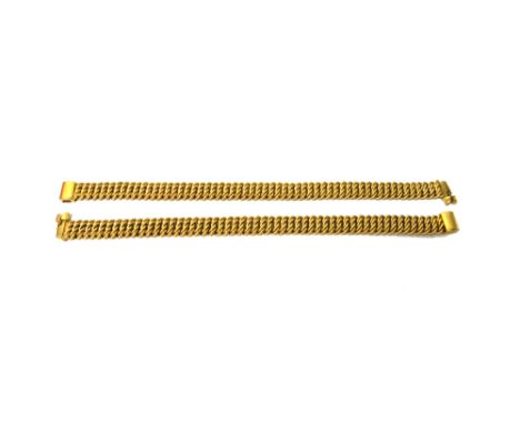 A pair of gold bracelets, each in a serpentine multiple scroll link design, on a sliding clasp, detailed 14 K, length 18cm, c