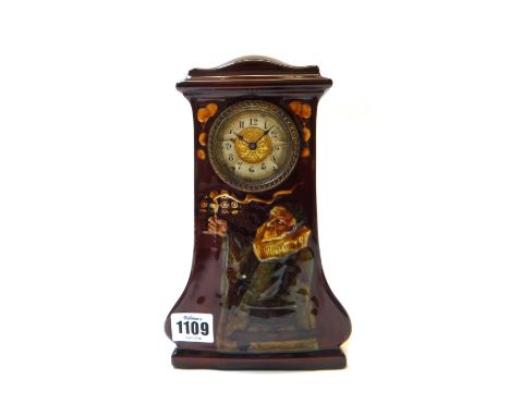 A Royal Doulton Art Nouveau kingsware clock designed by C. Noke, circa 1913, relief decorated with an alchemist against a bro