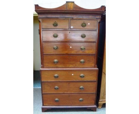 A George III mahogany chest on chest, the shaped cornice over two short and six long drawers, on bracket feet, 112cm wide x 1