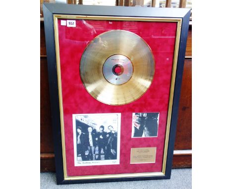 A Rolling Stones presentation record 'Sticky Fingers' with signed black and white photograph, framed and glazed as one, 78cm 