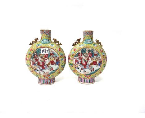 A pair of Chinese yellow ground famille rose moonflasks, late 19th century, each painted on one side with a figurative panel,