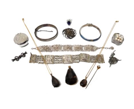 Silver and other jewellery, comprising; a stick pin, formed as a claw holding a cat's eye, two filigree bracelets, a cultured