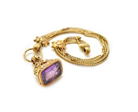 A Victorian gold and amethyst set pendant fob seal, seal engraved with a crest and a monogram, the mount with foliate and fea